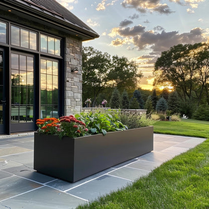 Metal planter and modern house. Long power coated rectangular steel planter thick gauge high quality welded in America USA made craftsman bespoke in the backyard of a modern stone house.
